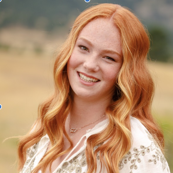 young woman with red hair for acne testimonial